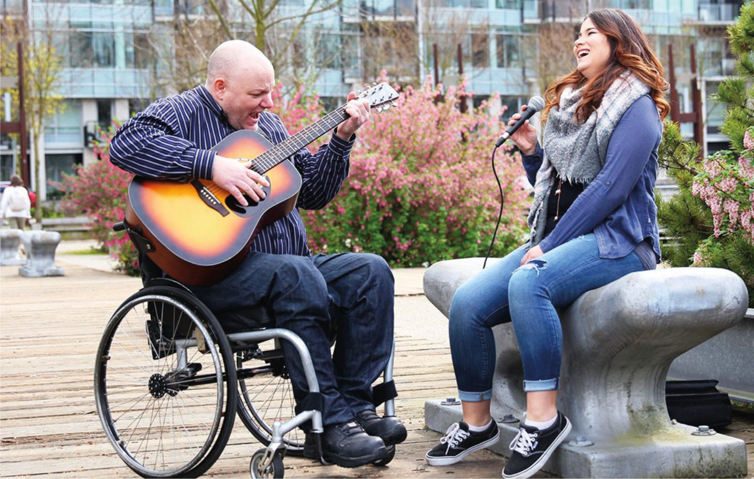 VAMS members playing music while busking outside.